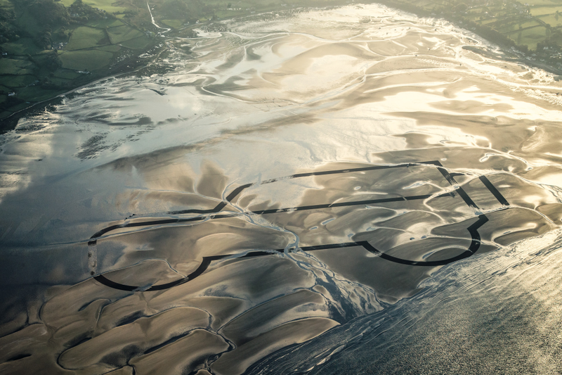Illustration for article titled A Gigantic Sand Drawing Is How Land Rover Said Farewell To The Defender